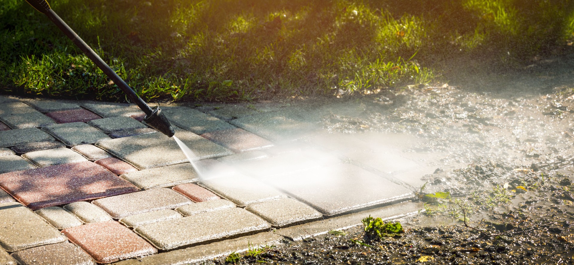 dirty block pavement cleaning with high pressure washer. copy space